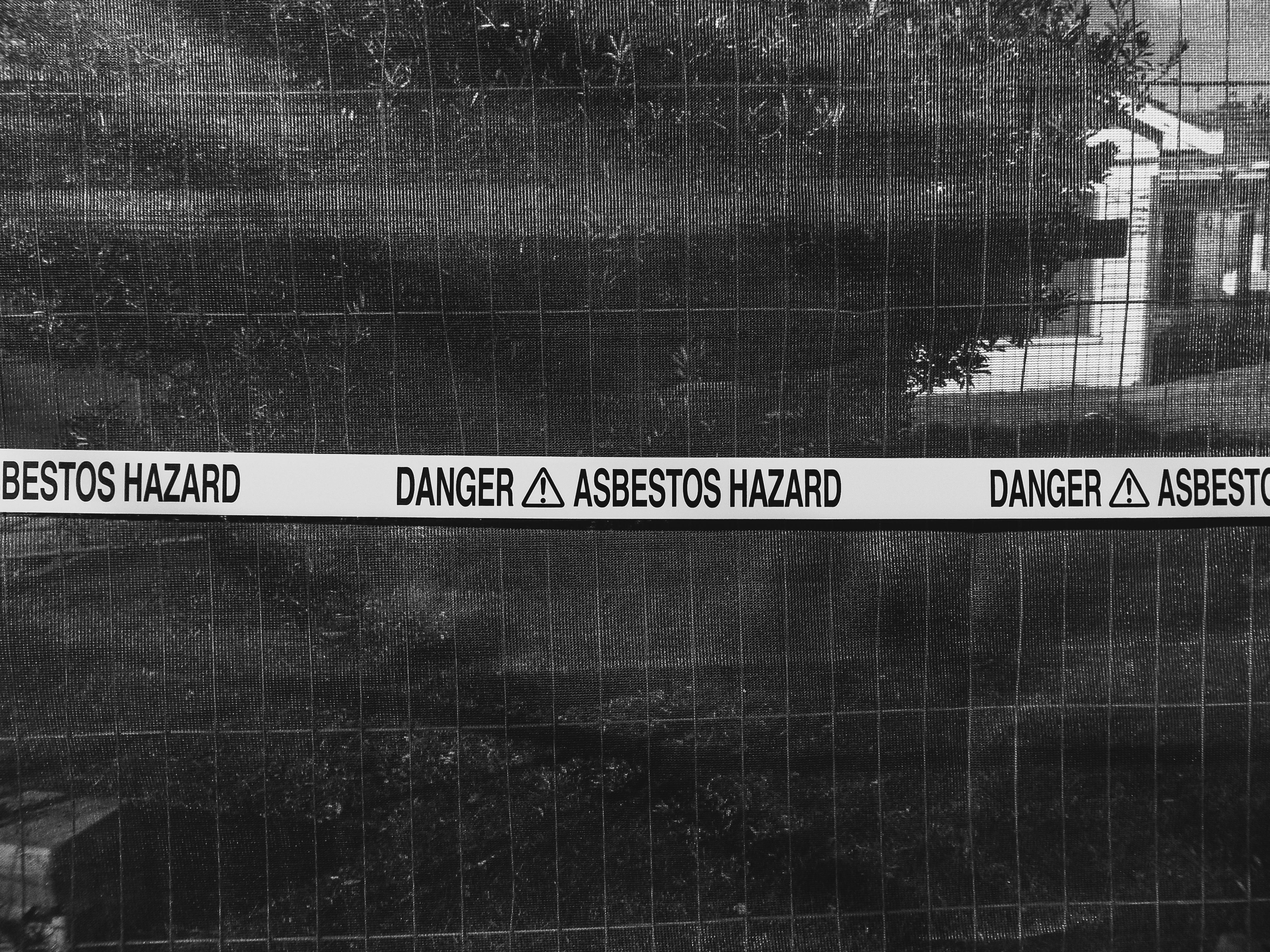 Warning tape for an area containing asbestos roof tiles