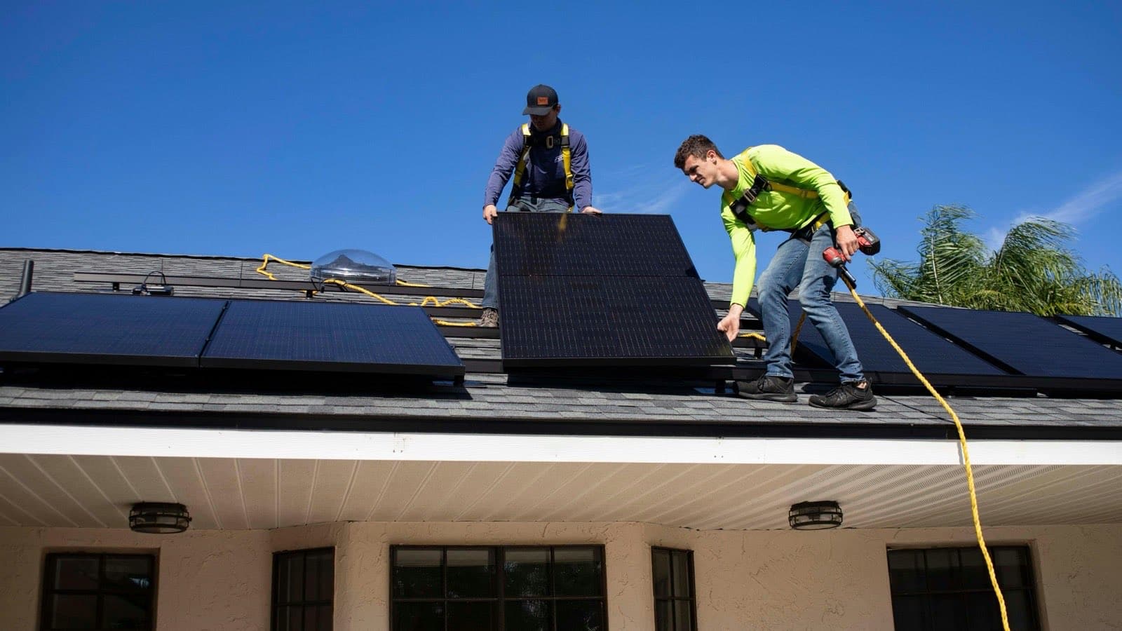 men on top of a roof