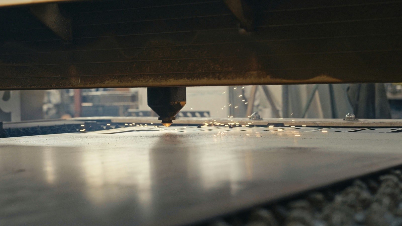 close up of a machine cutting a piece of metal