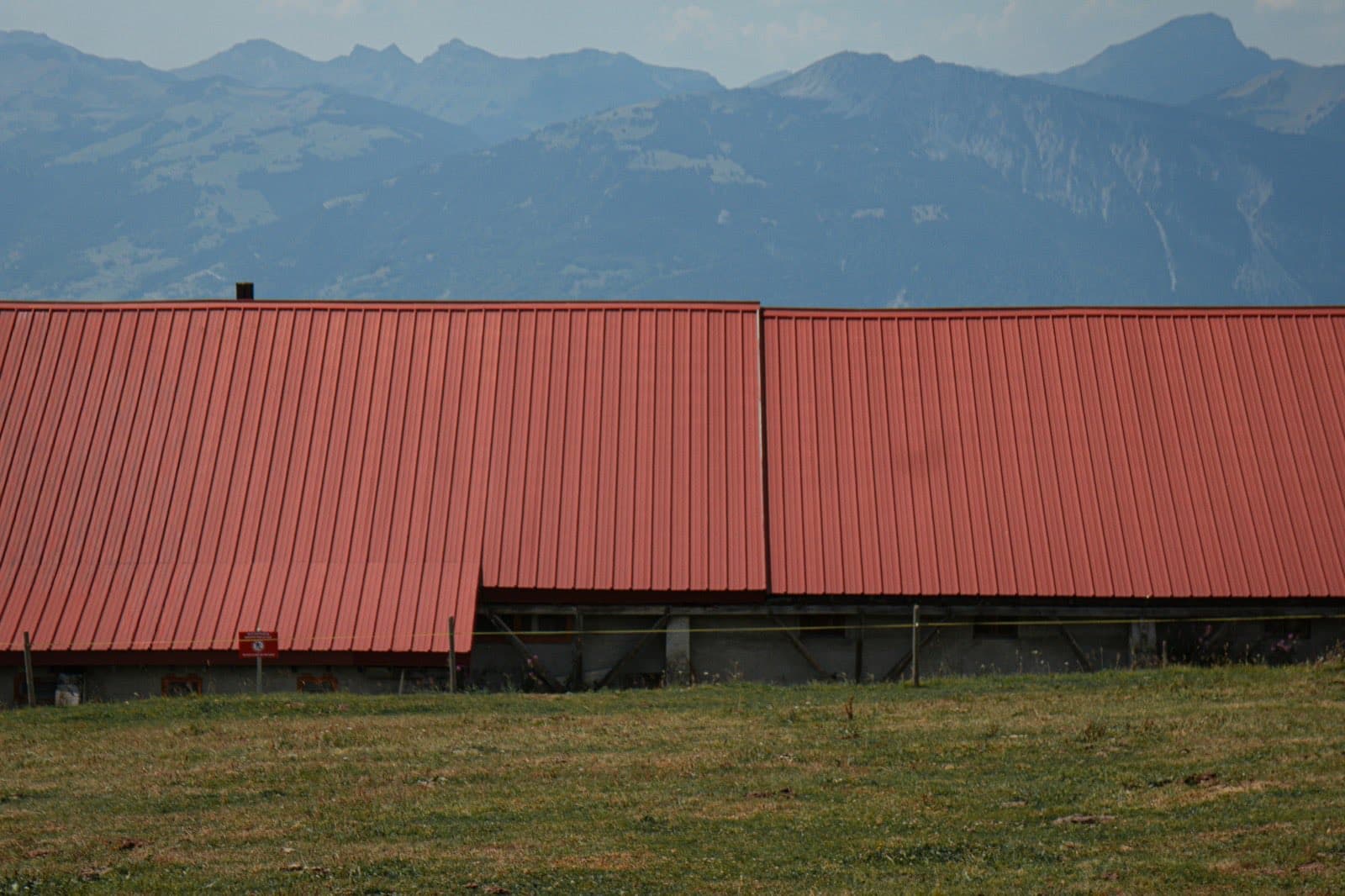 a long metal roof on a rural agricultural building