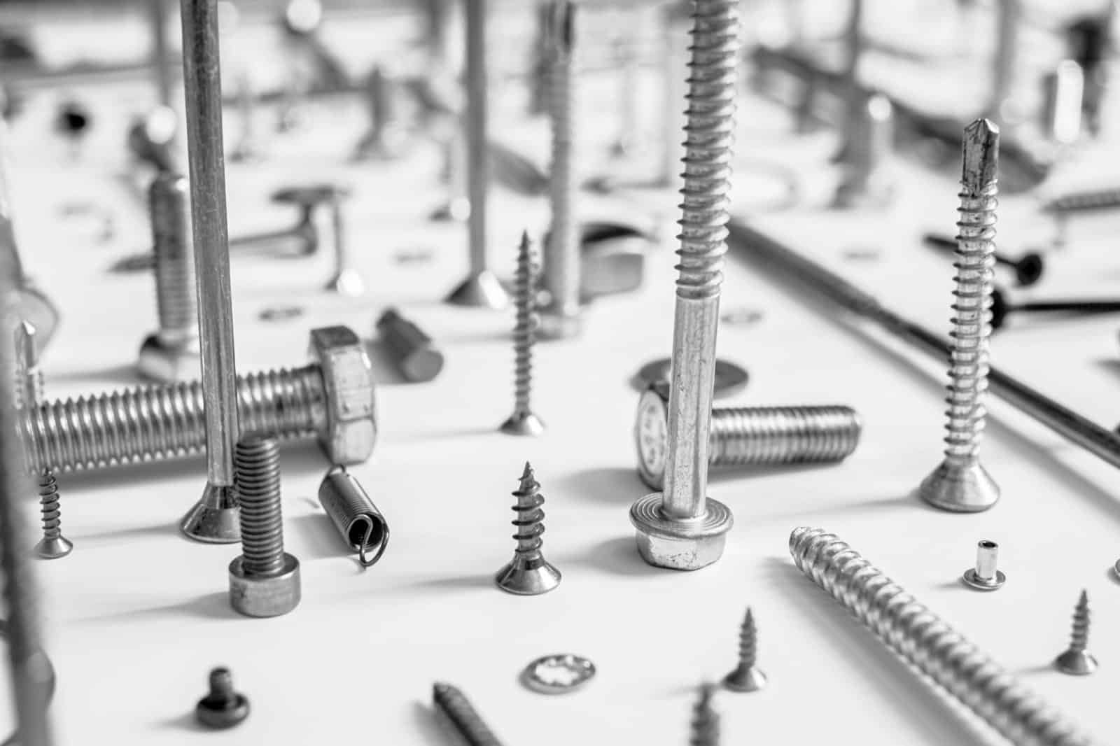 a collection of screws and fixings on a table